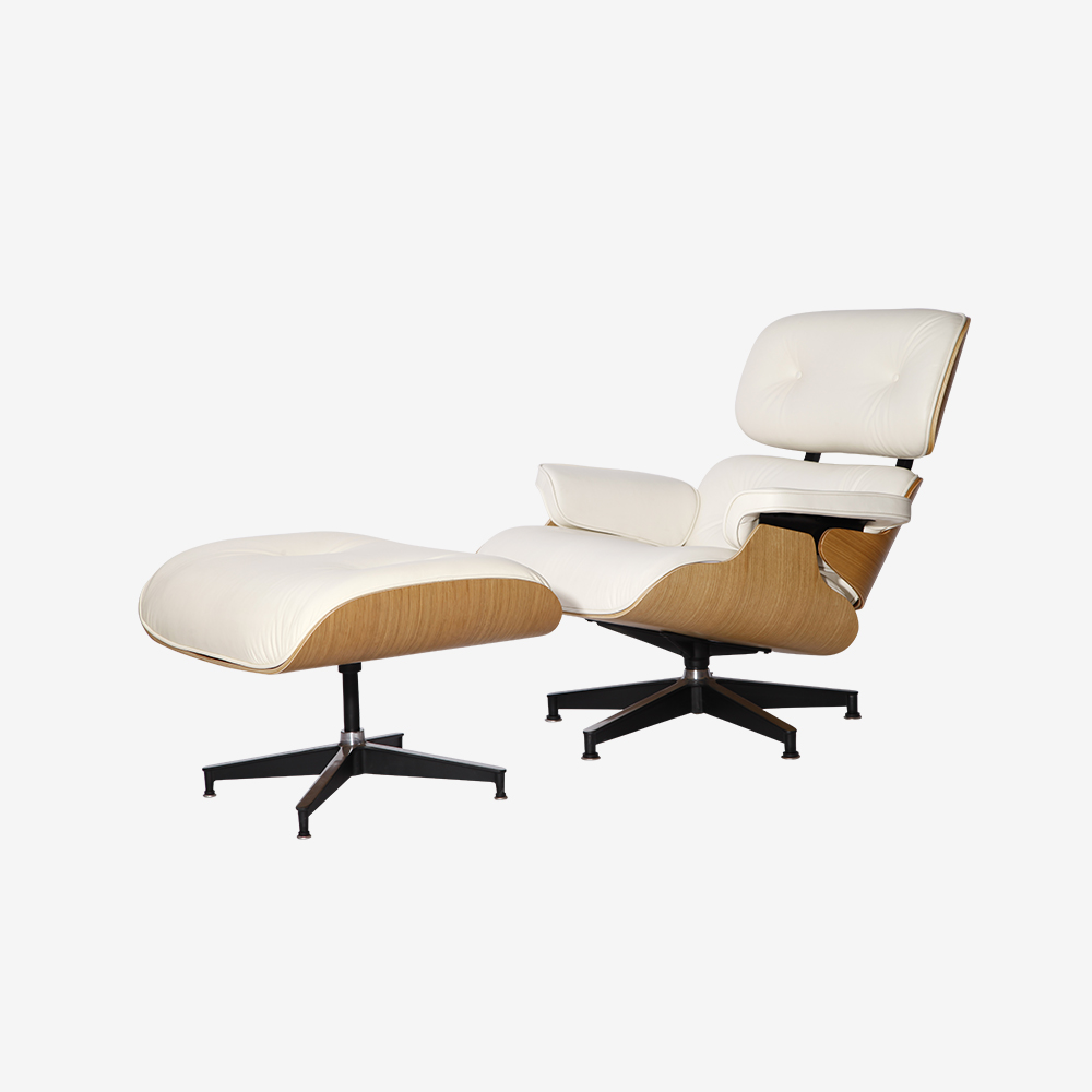 White Eames char facing left with ottomon